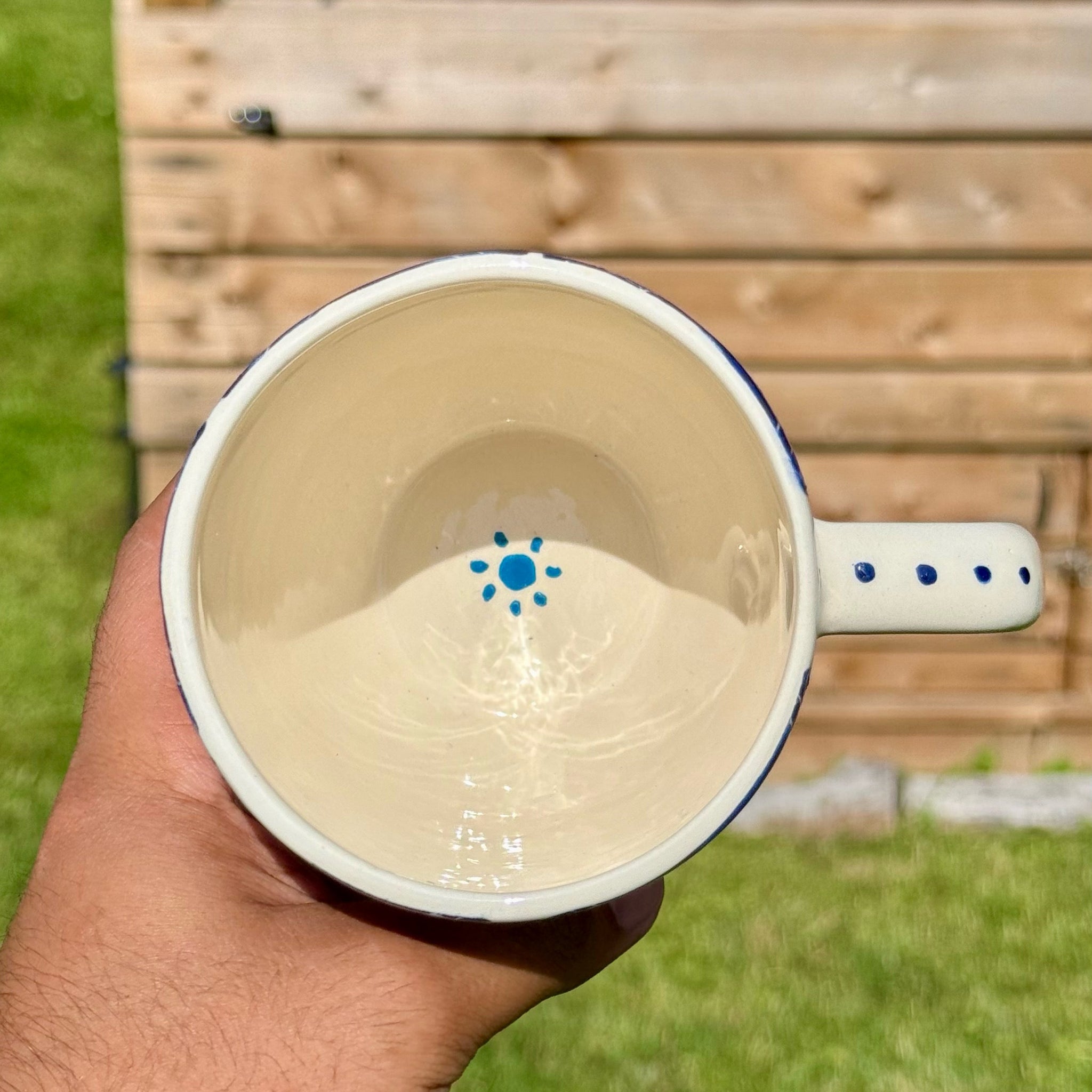 Handmade ceramic mug with artistic design