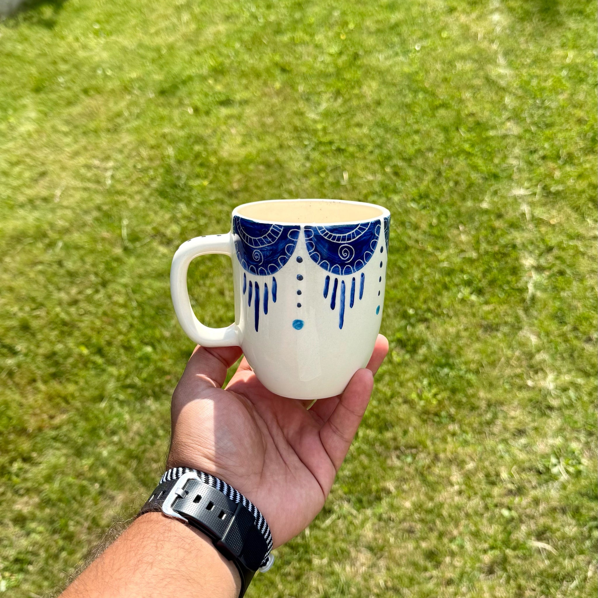 Handmade ceramic mug with artistic design
